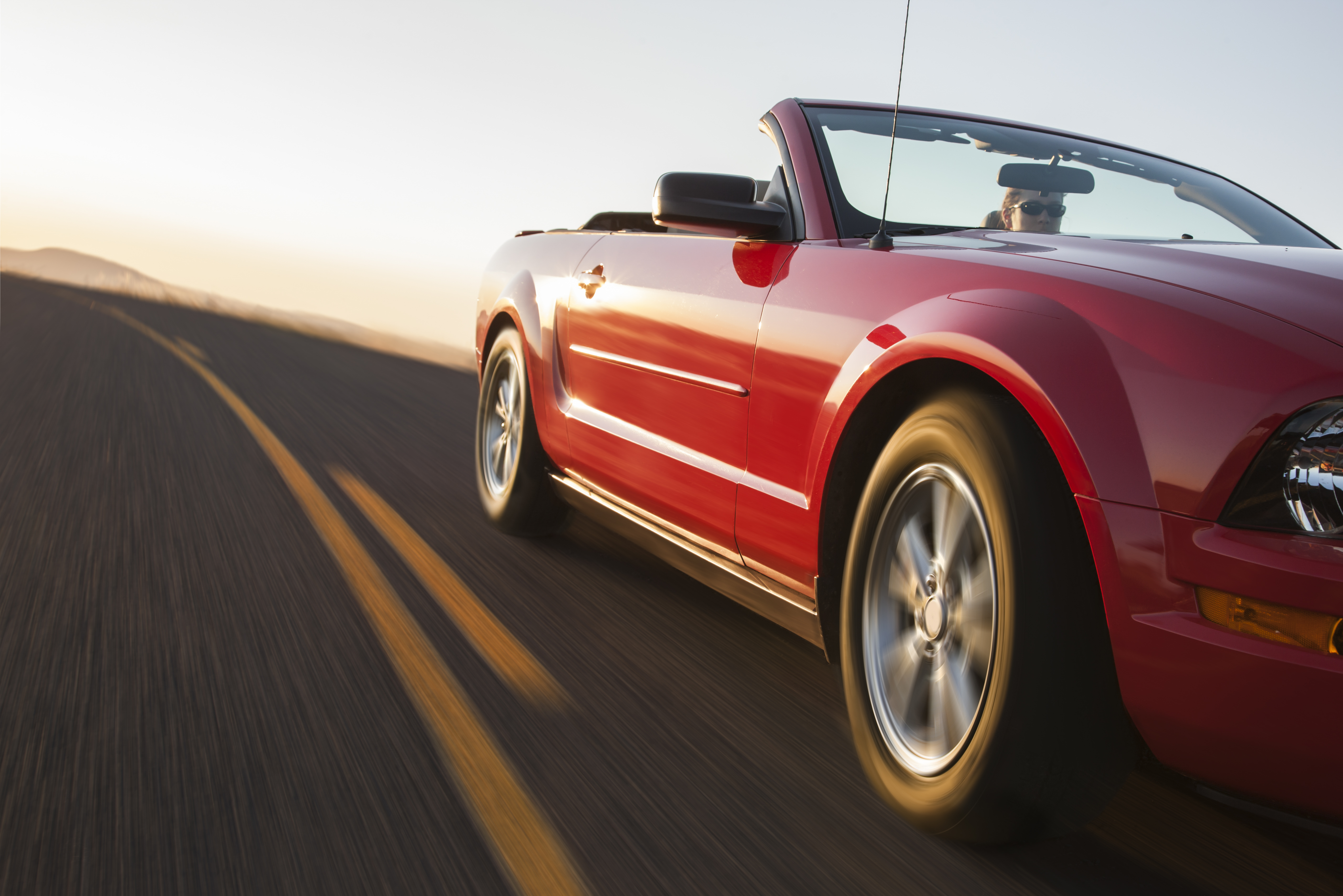 Low angle view of a convertible sports car in motion