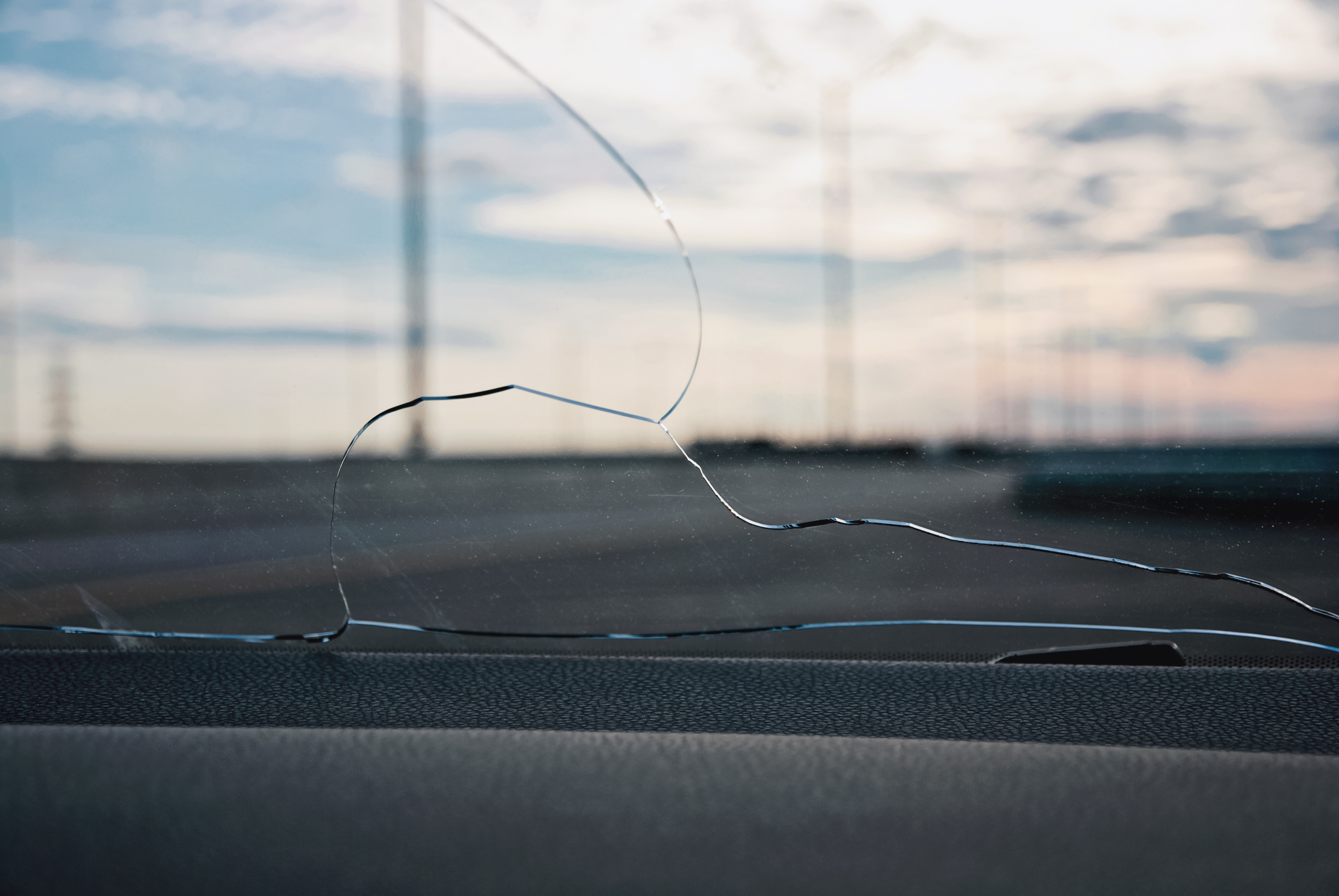 Cracked windshield damage on a vehicle